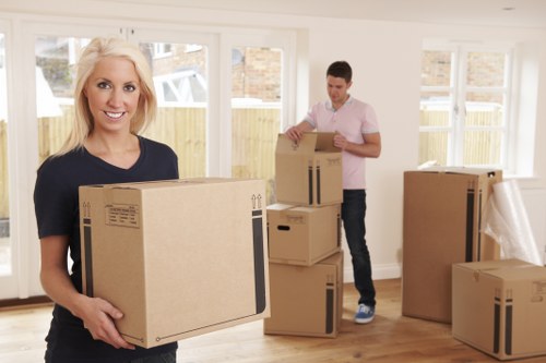 Moving van and removal team preparing a home move in Ratcliff