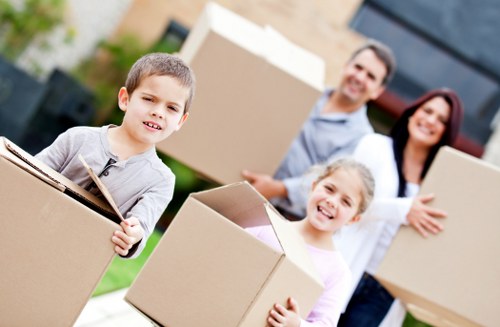 Packed moving boxes and wrapped furniture ready for a home removal