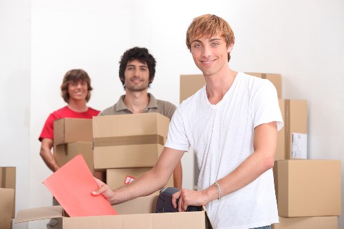 Furniture and small household items being loaded for transport in East London
